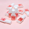 Various bottles of Pro's Choice Glue for acrylic art nail glue displayed on a pink background.