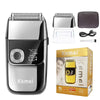 A silver and black electric shaver with a detachable head and accessories shown on a box.