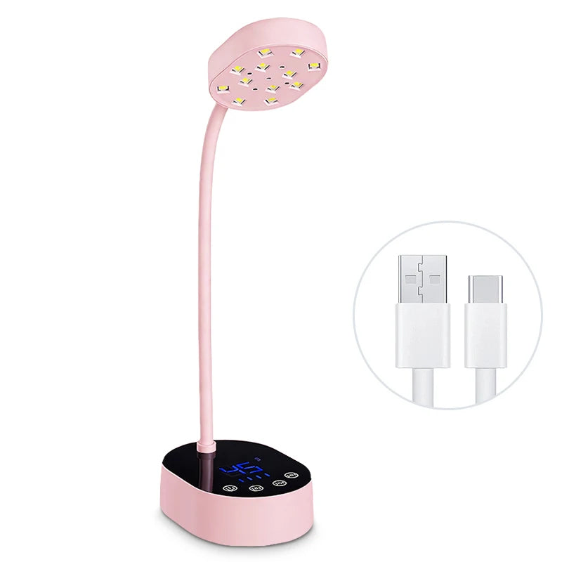 A pink professional UV LED nail lamp with a flexible arm and a light panel.
