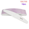 A white grit nail file is shown next to a purple striped pad, indicating 100 out of 100 quality.
