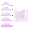 A set of pink silicone eyelash curlers in various sizes XS to XL displayed next to a clear plastic container.