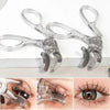 A set of professional clear plastic eyelash curlers shown in various angles.