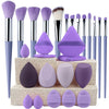 A complete makeup brush set featuring various sizes and shapes of purple and pink synthetic bristles and sponges.