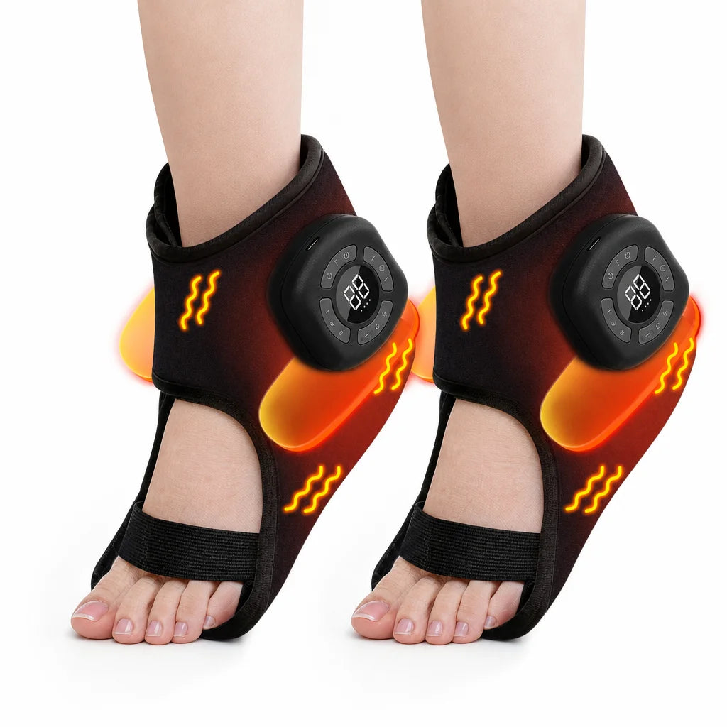 A pair of black ankle foot massagers with orange accents are shown on a person's feet.