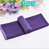 Purple ultra soft quick-dry sport towel rolled up on a white background