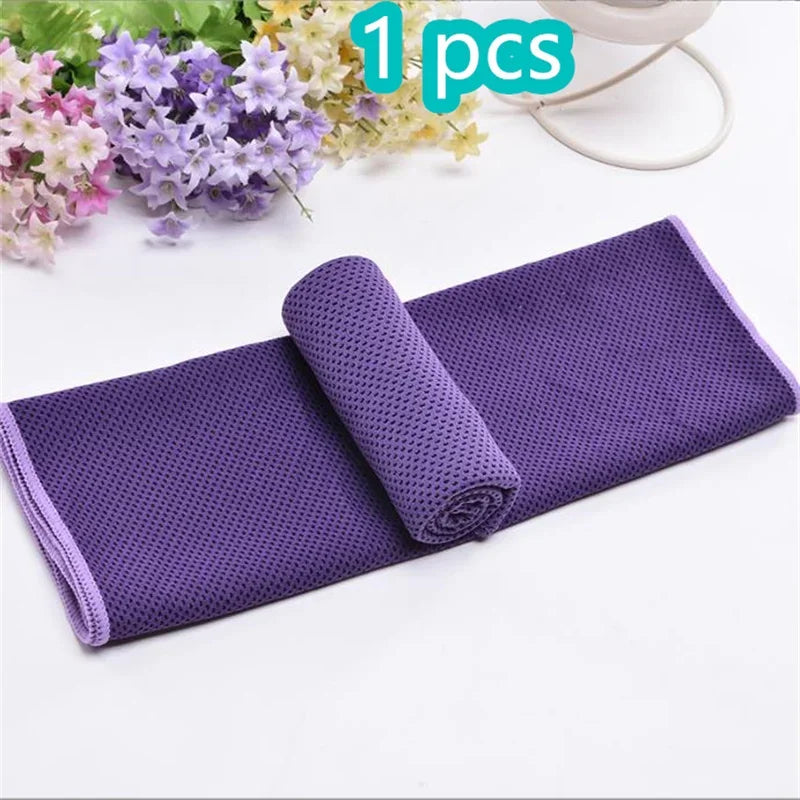 Purple ultra soft quick-dry sport towel rolled up on a white background