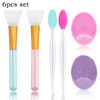 A set of six silicone facial cleansing brushes and mask applicators in various colors including light blue, pink, and purple.