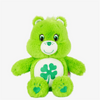 A bright green classic Care Bears plush stuffed animal doll with a smiling face and a green clover detail on its paws.