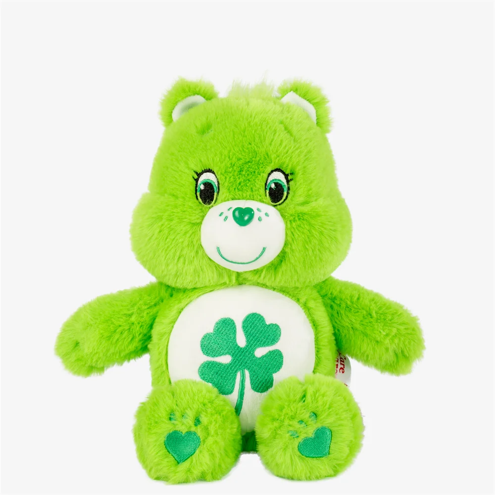 A bright green classic Care Bears plush stuffed animal doll with a smiling face and a green clover detail on its paws.