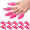 A hand is shown holding several bright pink reusable nail soak-off caps for gentle gel polish removal.