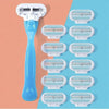 A collection of multi-blade safety razors in various sizes and colors displayed against a pink and blue background.