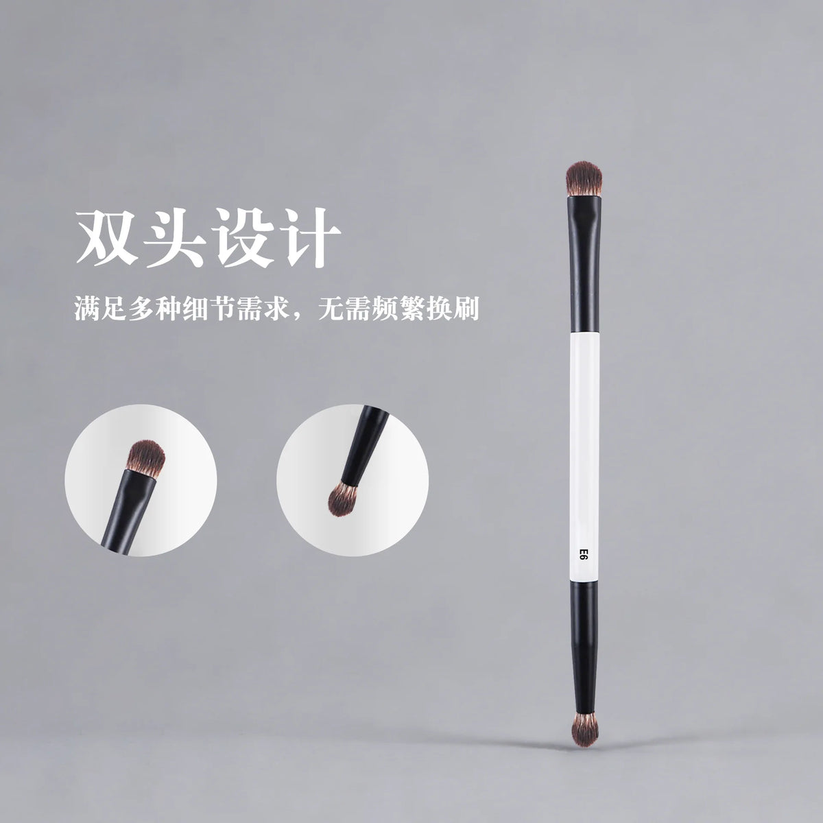 A long, black dual-ended makeup brush with a tapered tip and white handle is shown against a gray background.
