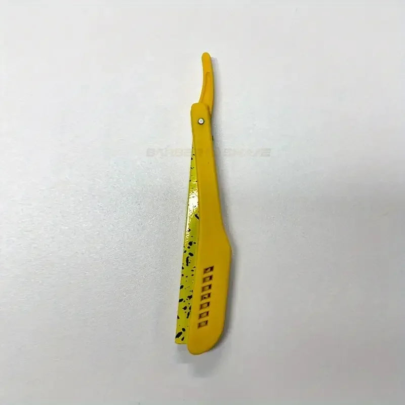 A yellow men's classic folding shaving razor with a yellow handle and black patterned blade.