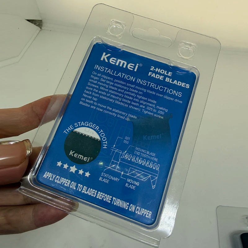 A clear plastic package containing installation instructions for Kemei 2-hole fade blades.