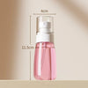 A pink mist spray bottle with a white pump dispenser is shown against a light background.