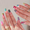 A hand displays a set of 24 press-on coffin nails featuring various pastel and glittery designs.