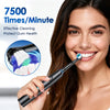 A woman is using a black rotary electric toothbrush to clean her teeth.