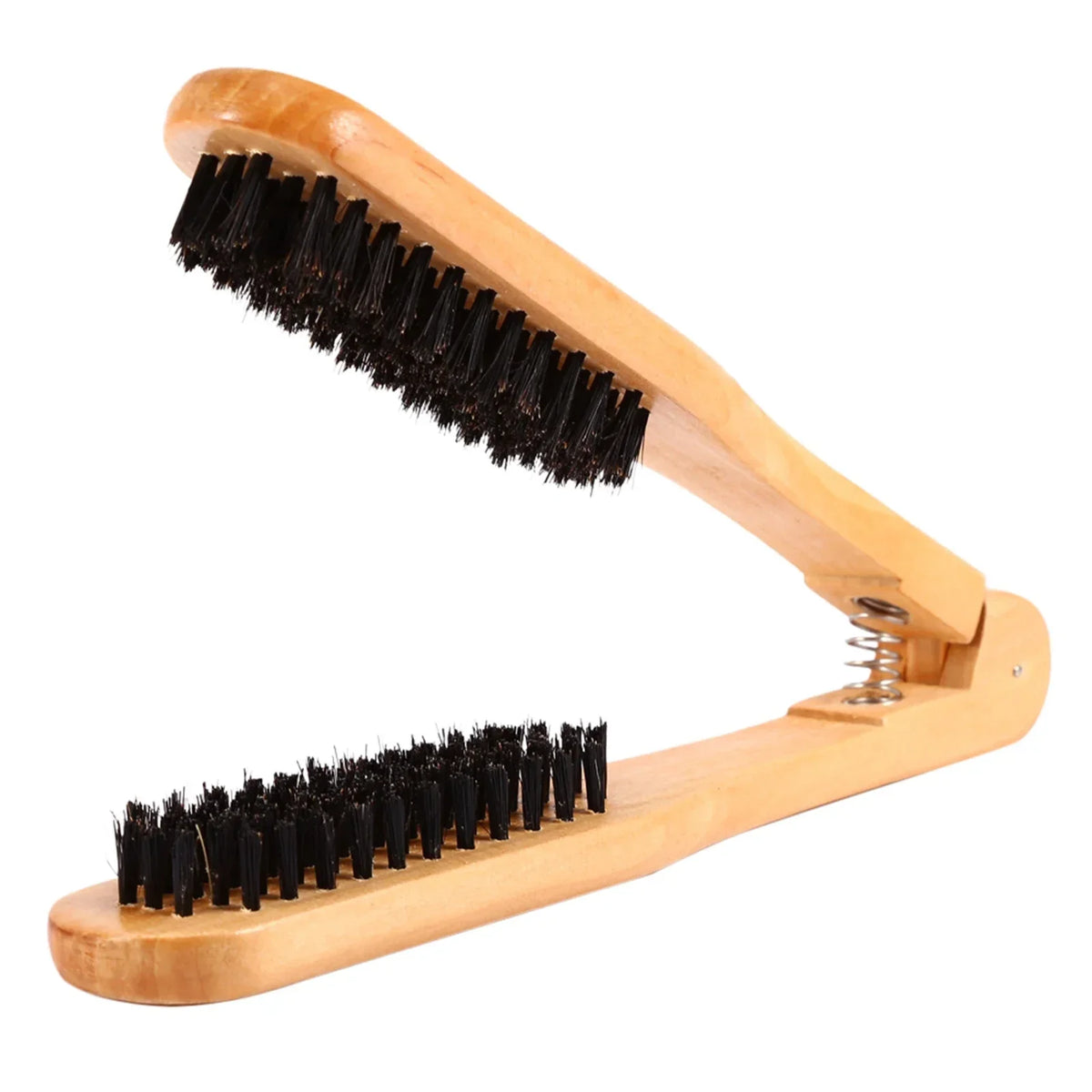 A wooden hair comb with two black bristles is shown in a profile view.