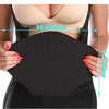Black lumbar molder compression support board being held against a woman's torso.