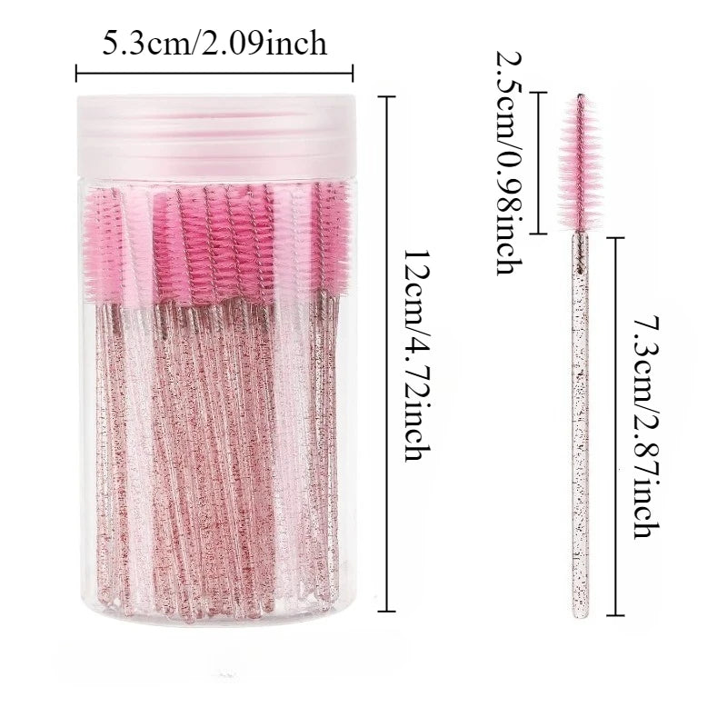 A clear container holding pink and black disposable eyelash and eyebrow makeup brushes.