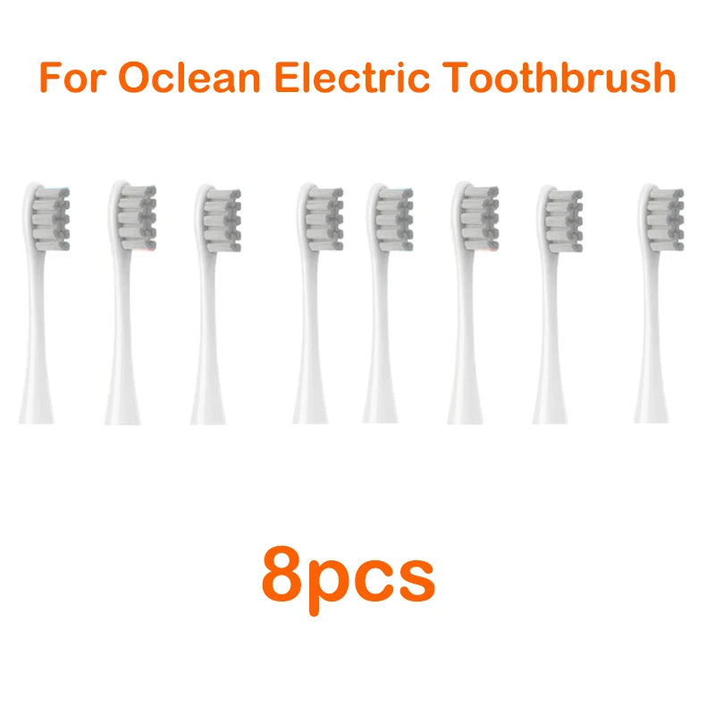 Eight replacement brush heads for an Ocean electric toothbrush, shown individually.