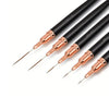 A set of black and rose gold nail art liner brushes with ultra-fine tips.