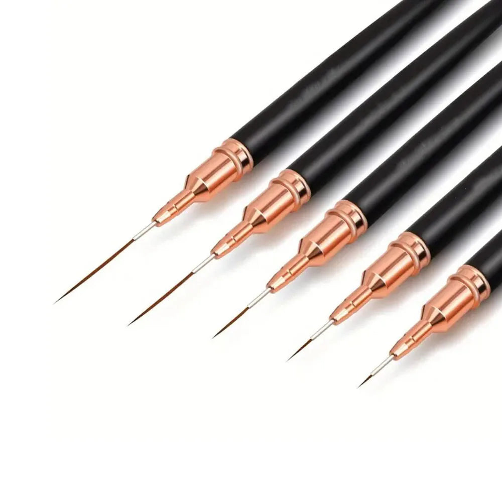 A set of black and rose gold nail art liner brushes with ultra-fine tips.
