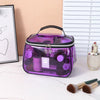 A purple clear PVC cosmetic bag with a zipper containing various beauty products is displayed on a white surface.