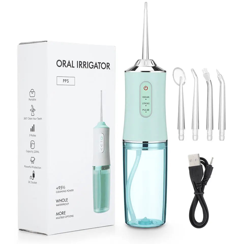 A box and contents of a portable oral irrigator device with a green and silver color scheme.