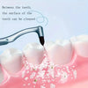 A manual tooth stain remover with an interdental brush cleaning between teeth surfaces.