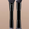 A pair of black makeup brushes with silver bristles displayed against a beige background.