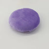 A round, purple jumbo soft powder puff used for flawless makeup application.