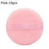 Pink makeup puffs with a pink elastic band for concealer and powder application