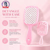 A pink detangling hair comb is shown with a white bristles, highlighting its features for easy detangling.