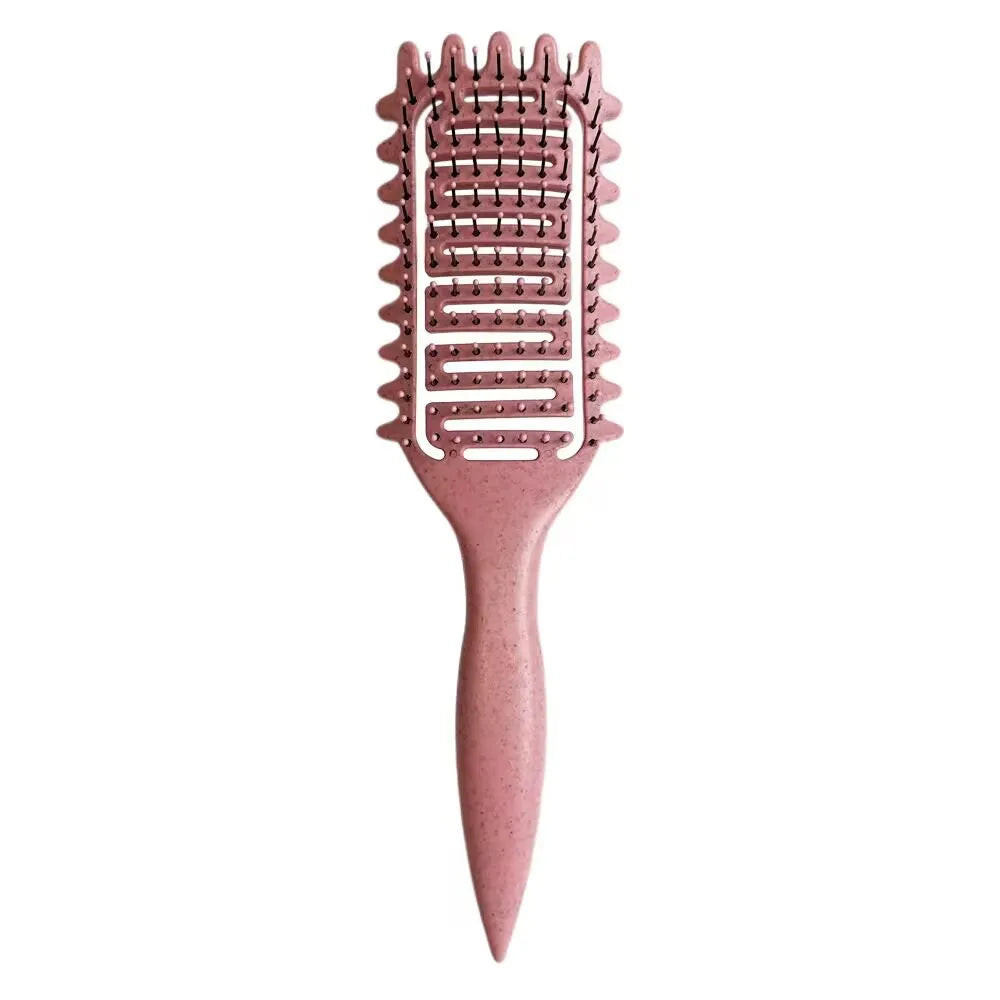 A pink professional curl define styling brush with fine teeth and a tapered handle.