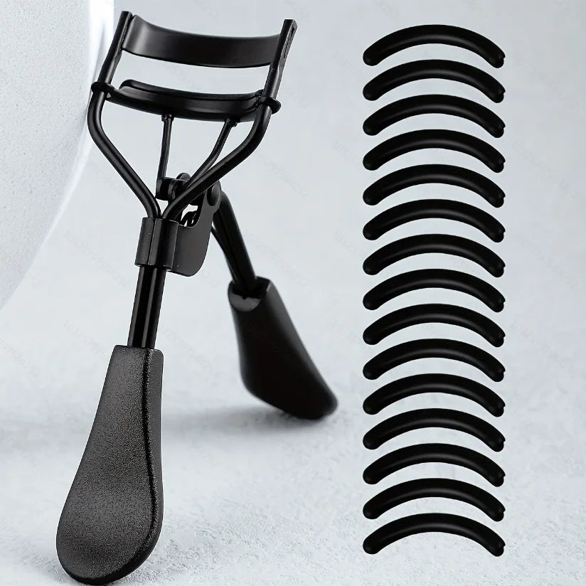 A black professional eyelash curler set showing the curler and a coiled metal tool.