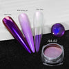 A set of nail glitter powders including black base, purple, and clear base, displayed next to a jar.