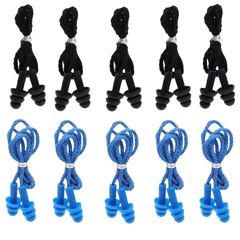 Un ensemble de bouchons d'oreille en silicone réutilisables de différentes couleurs et styles pour la réduction du bruit