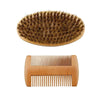 A set of professional boar bristle beard and mustache combs, featuring a round comb and a straight comb.