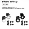 Collection de bouchons d'oreille en silicone noirs, de différentes tailles et styles, y compris des capsules et des anneaux.