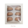 A box containing multiple pairs of realistic silicone eyelash extensions for practice.