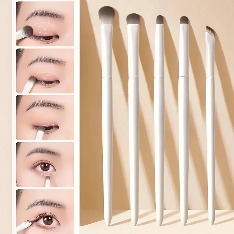 A set of five professional makeup brushes shown in various angles and on a light background.