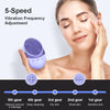 A woman is using a purple silicone facial cleansing brush for vibration frequency adjustment on her face.