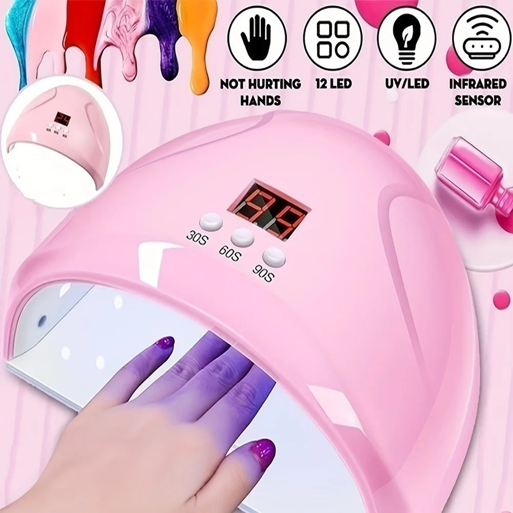 A pink professional UV/LED nail curing lamp is shown with a hand applying the light to a nail.