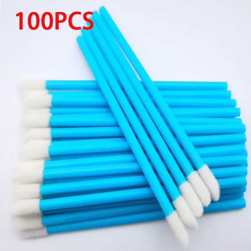 A set of 100 precision makeup brushes with blue handles and white bristles arranged diagonally.