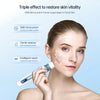 A woman applies an EMS microneedling device to her facial skin for rejuvenation treatment.