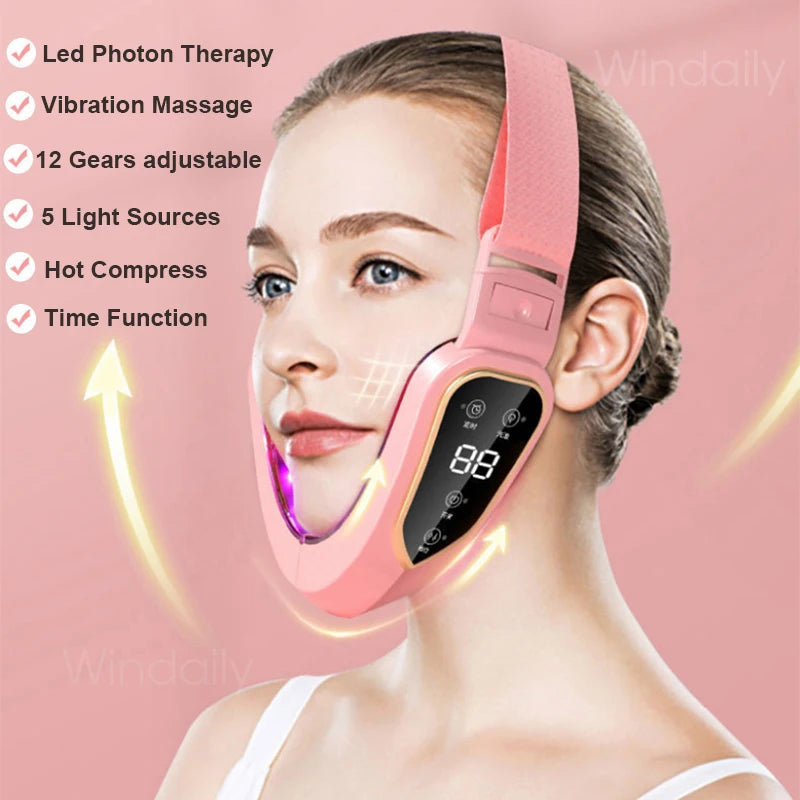 A woman is using a pink facial lifting massager with LED photon therapy on her face.
