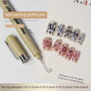 A set of nail painting graffiti pens with various tip diameters shown next to a piece of paper.