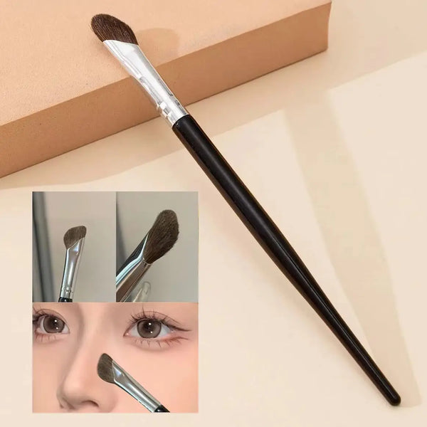 A black makeup brush used for contouring and nose shadow application, shown with close-ups of the bristles and tip.