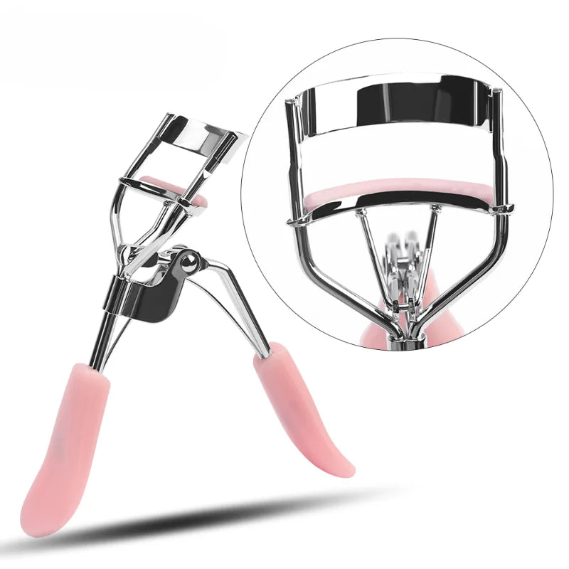A silver makeup eyelash curler with pink silicone pads shown in a close-up view.